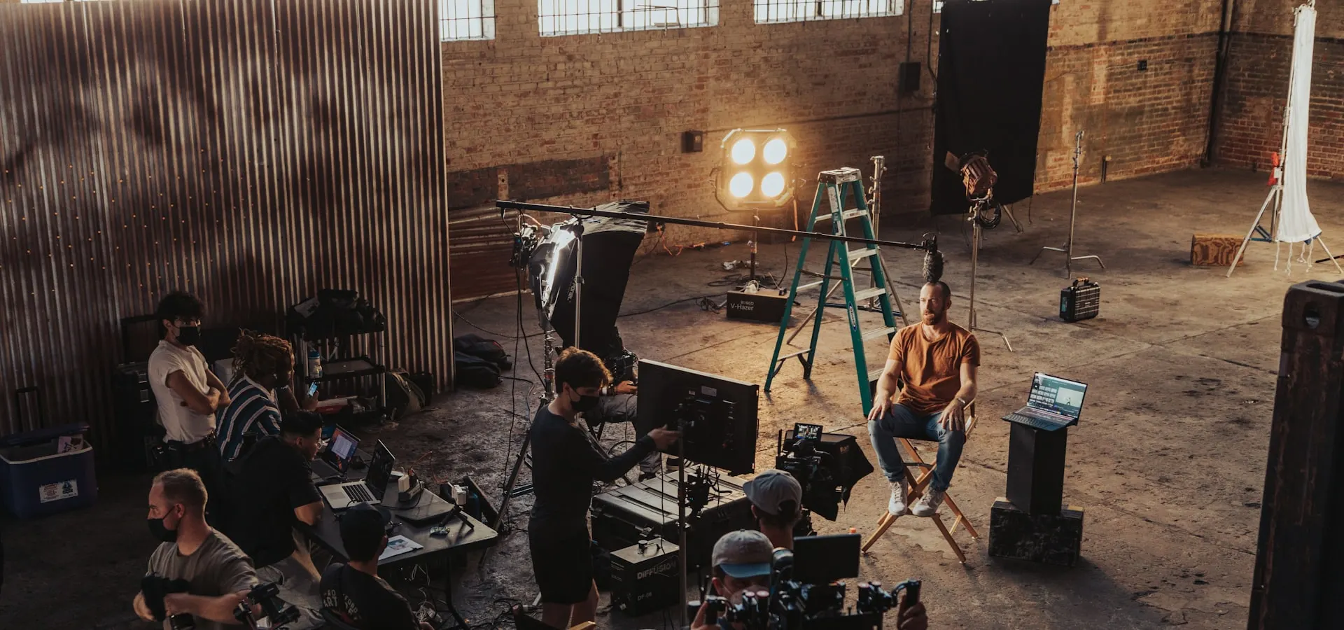A video production crew filming on set