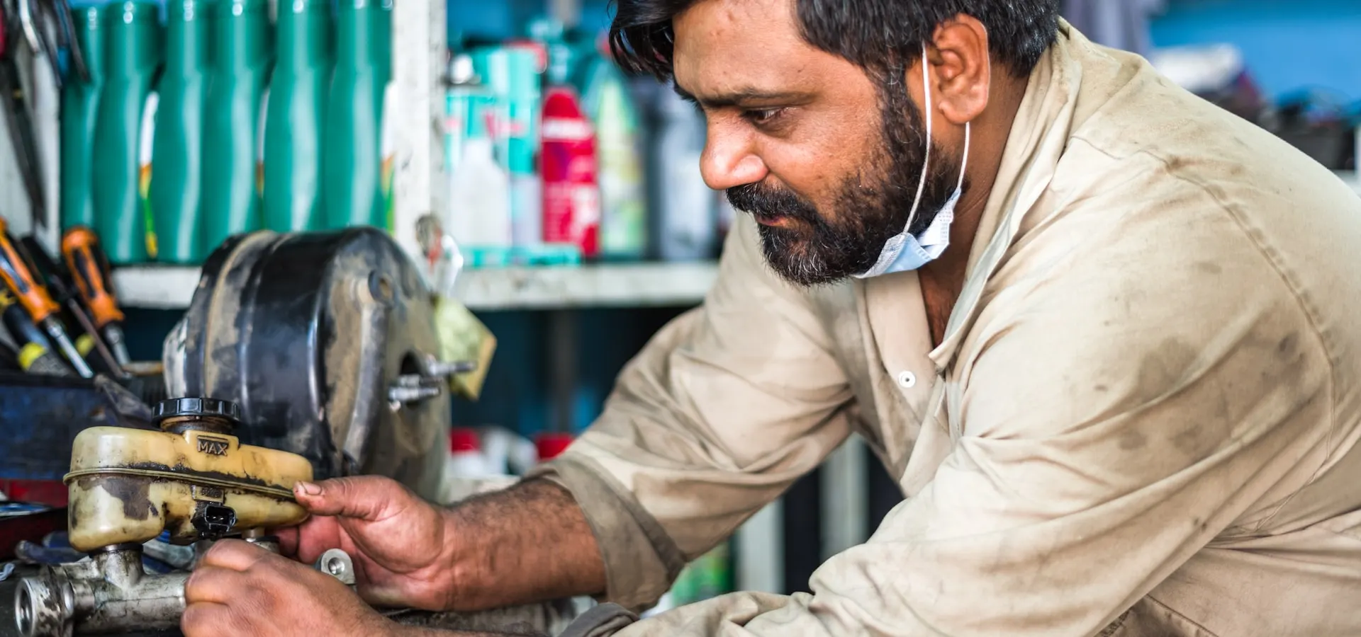 A technician repairing equipment in a workshop