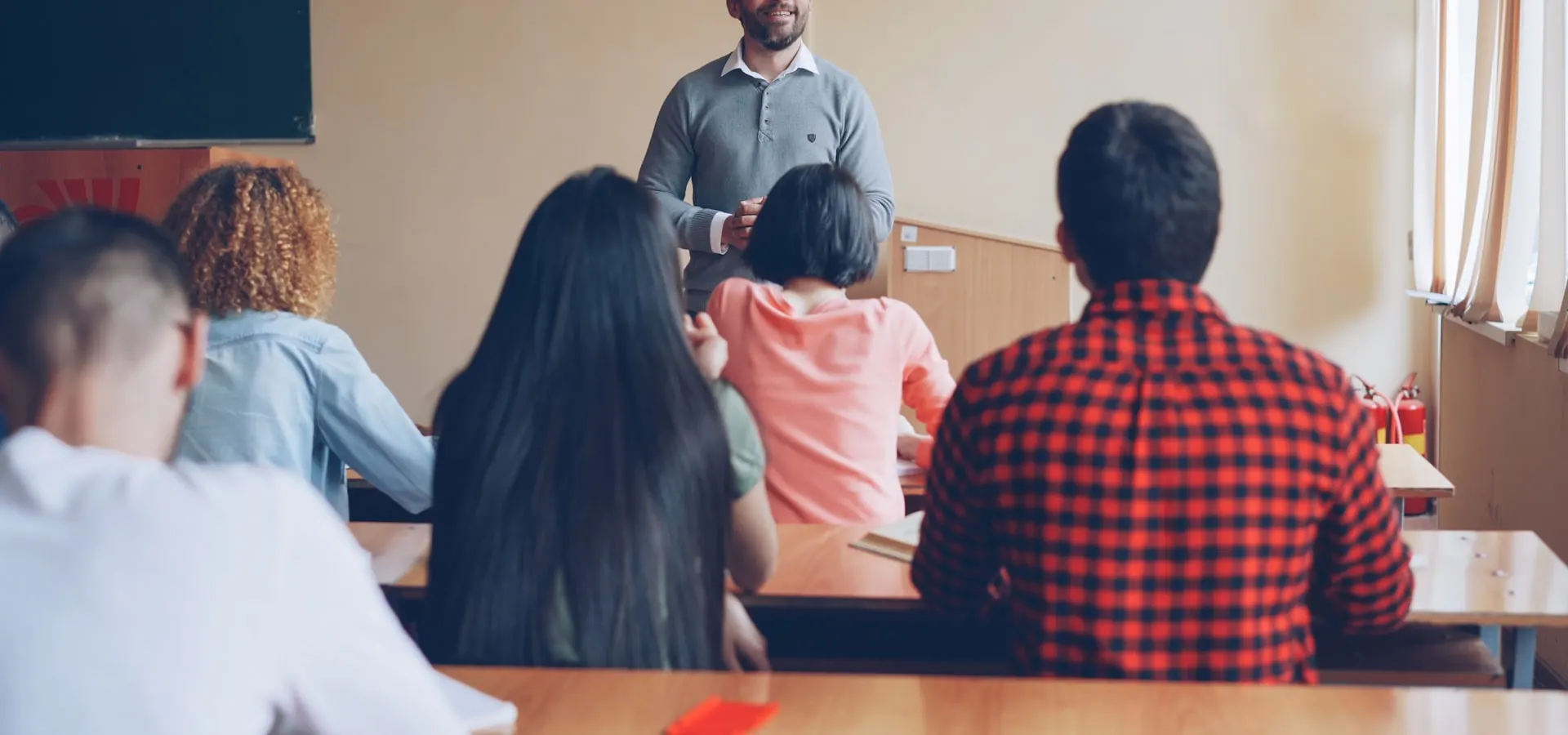A teacher leading a classroom discussion with students